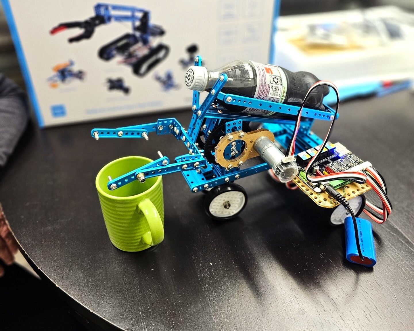 Kids and teens building robots in the MI-IMPACT Gear Up Robotics program