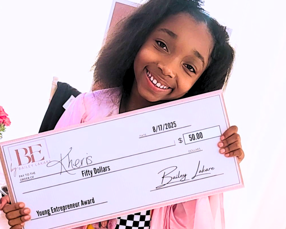 Kidpreneur-2.0-50-dollar-young-entrepreneur-winner-MI-IMPACT-Michigan Kidpreneur 2.0 winner holding a $50 prize check