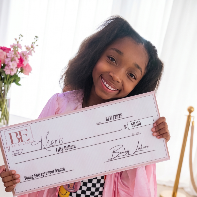 MI-IMPACT-Girl-holding-50-dollar-check-from-winning-young-entrepreneur-award-Detroit-Michigan-alternative-homeschool-online-school-programs Girl holding a $50 check after winning a MI-IMPACT young entrepreneur award