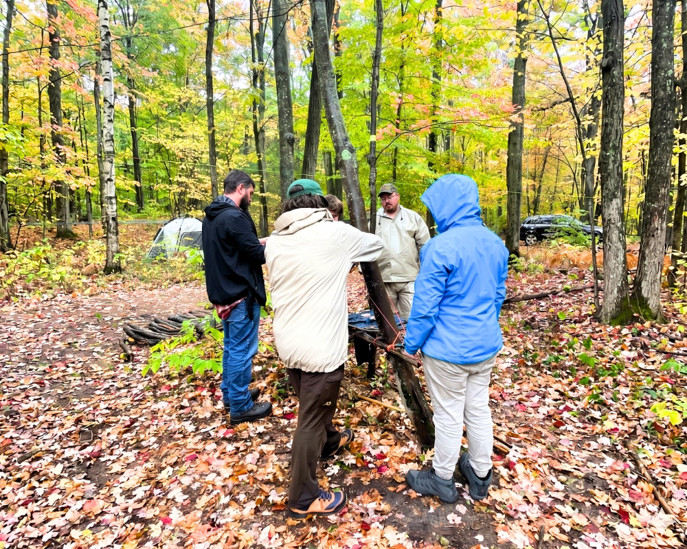 Students huddled together during a MI-IMPACT outdoor science program